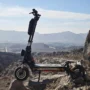 KuKirin G4 Max electric scooter riding on extreme off-road terrain-15